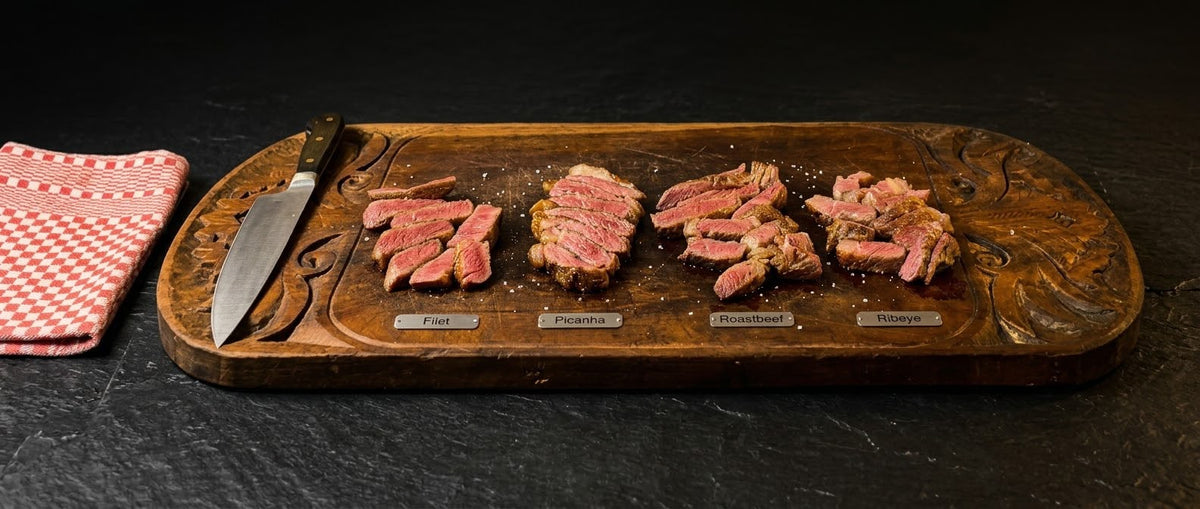 Filet, Picanha, Roastbeef und Ribeye - 70 Tage Wet Aged, aufgeschnitten auf einem Holzbrett